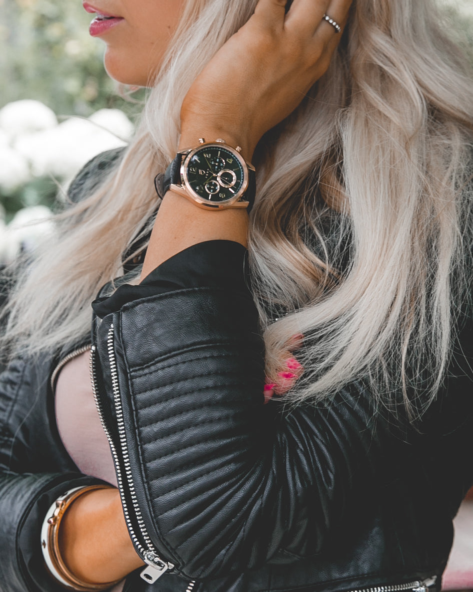 blonde women with black leather jacket and rose gold watch